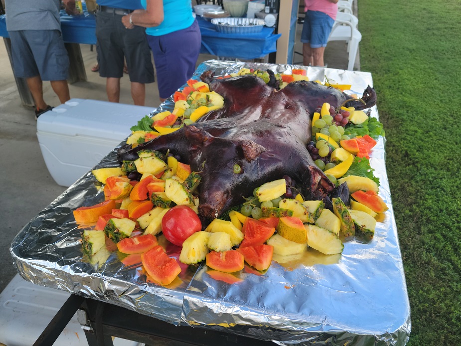Club pig roast at the field
