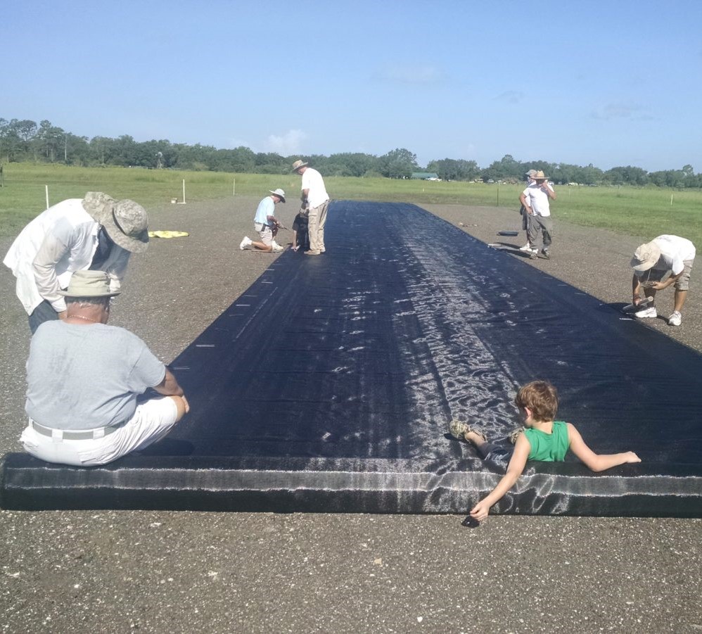 Members installing the runway surface